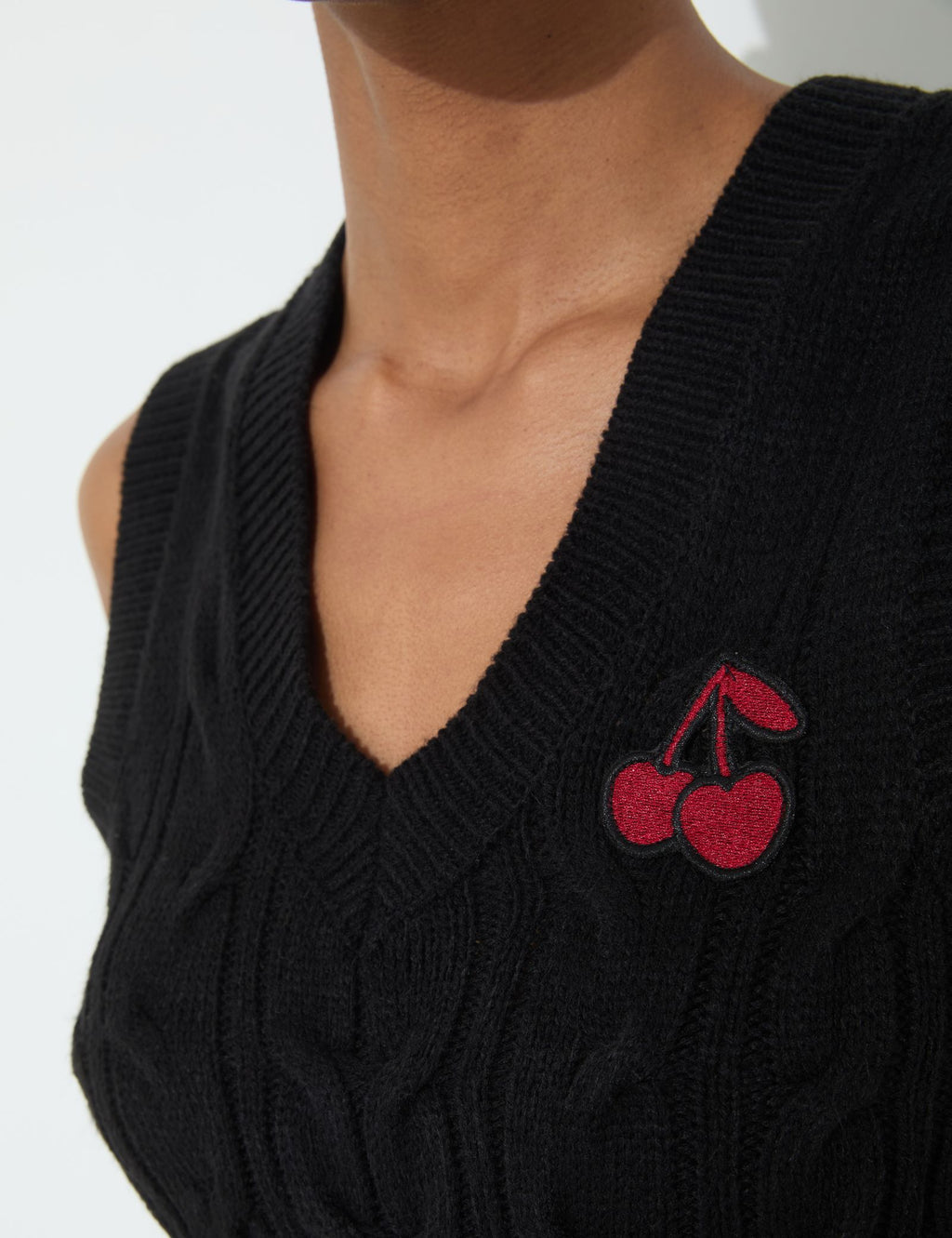 Cardigan sans manches noir à motif